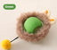 Self-Playing Rolling Cat Ball in green with soft outer fur and a yellow pom-pom for added cat engagement.