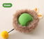 Self-Playing Rolling Cat Ball in green with soft outer fur and a yellow pom-pom for added cat engagement.