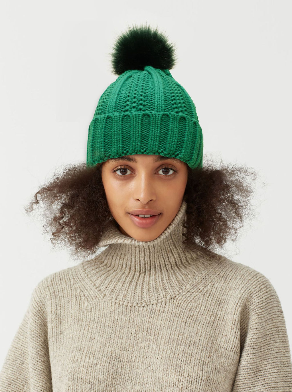 Winter Knitted Hats Fashion Stretchy Lined Skull Hats For Women Faux Fur Pom Pom Hat Keep Warming Beanie Hat in green.