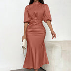 Women's Short Sleeve Ruched Midi Dress Slim Fit Elegant Party worn by a model in a soft rust color, showcasing its stylish silhouette.