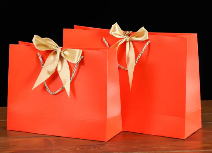 Bowknot Square Paper Bag in vibrant red with gold bowknot detail, perfect for stylish gift presentation.