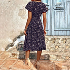 Summer Floral Print Maxi Dress Women Button Up Split Long Flowy Bohemian Beach Party Dresses worn outdoors with stone backdrop.