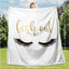 Flannel Velvet Blanket Long Eyelashes displayed outdoors, showcasing its cozy reversible design and cute 'lash out' print.