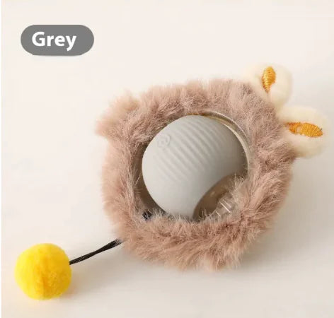 Self-Playing Rolling Cat Ball in grey with fuzzy texture and playful yellow toy component.