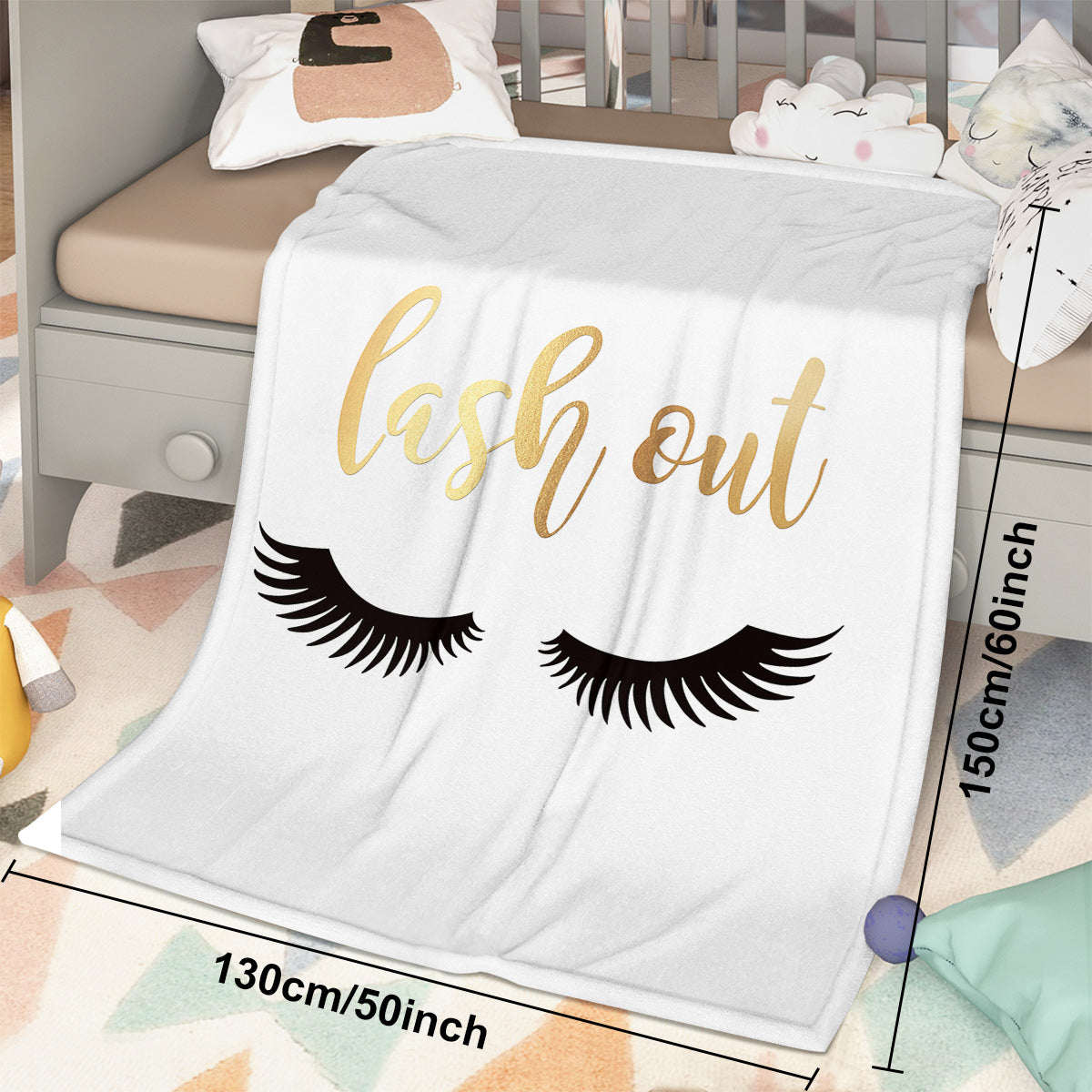 Flannel Velvet Blanket Long Eyelashes with lash out design in kids' room, featuring black eyelashes on white fabric.