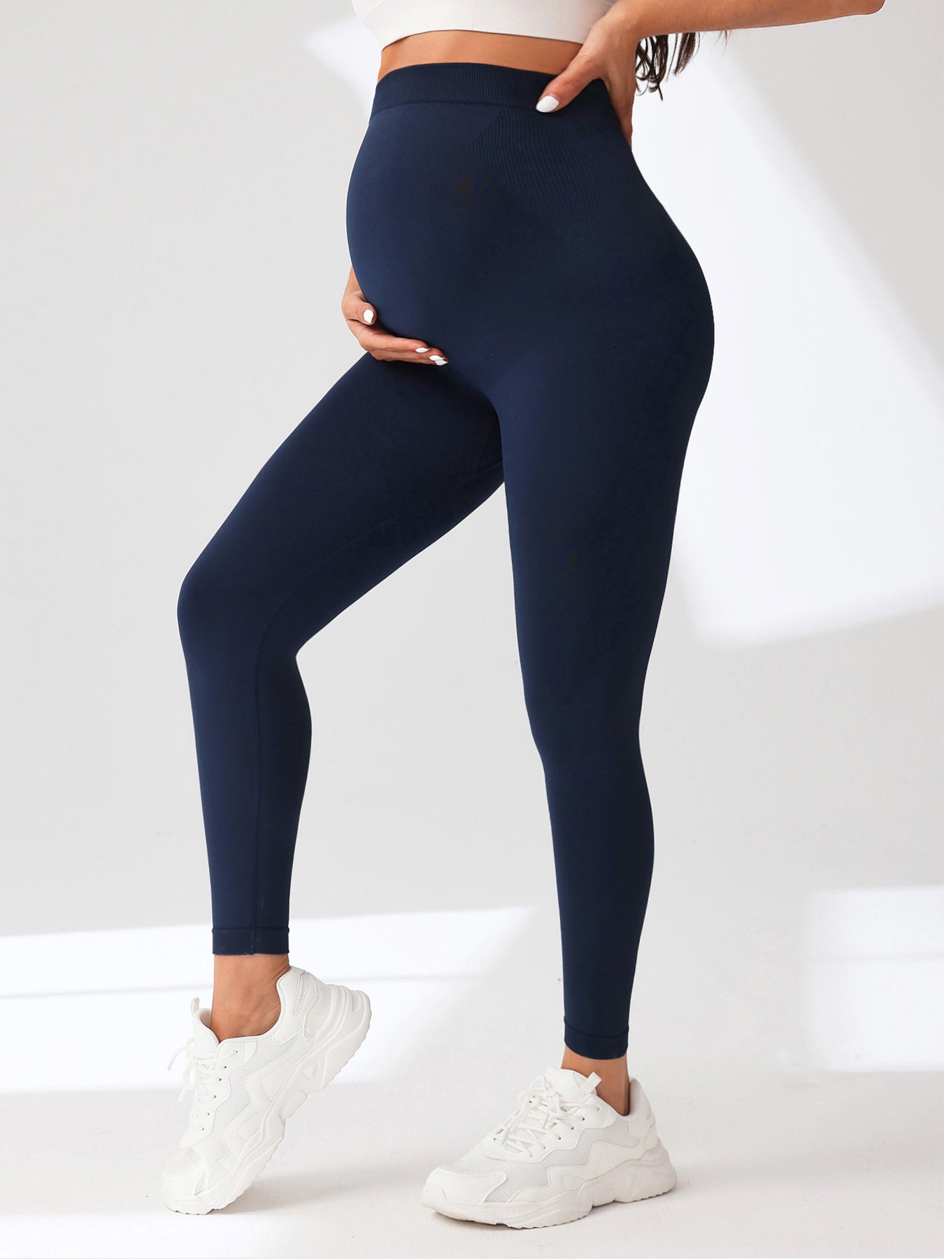 Women's Maternity Leggings Over The Belly Pregnancy Yoga Pants Active Wear Workout Leggings in navy blue.