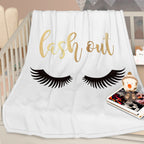 Flannel Velvet Blanket Long Eyelashes displayed on a crib with decorative lashes and word "lash out" in stylish font.
