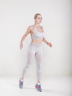 Woman demonstrating fitness pose in Solid-color Yoga Pants Sport Yoga Pants for workouts and casual wear.